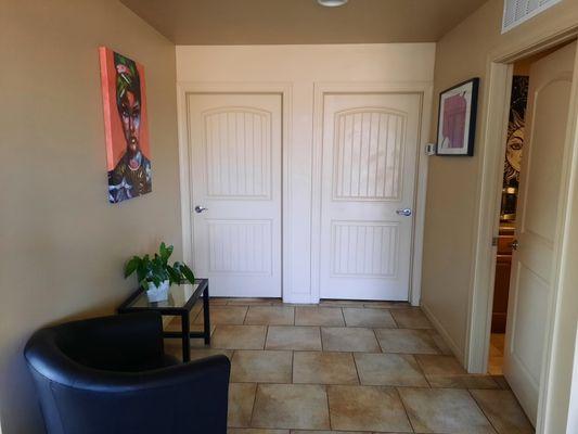 Smaller waiting area with a view of the treatment rooms