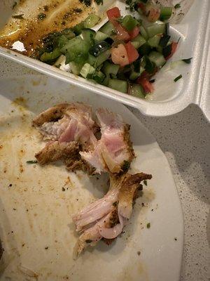 Undercooked chicken and a salad