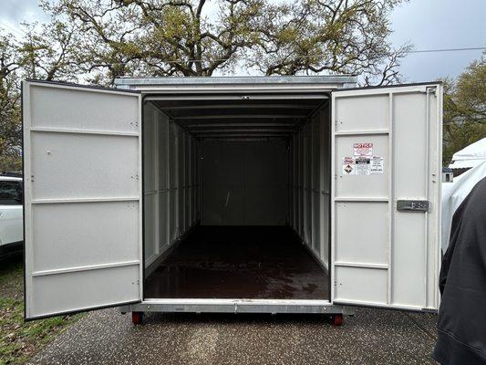 Front view of storage container with both doors wide open.