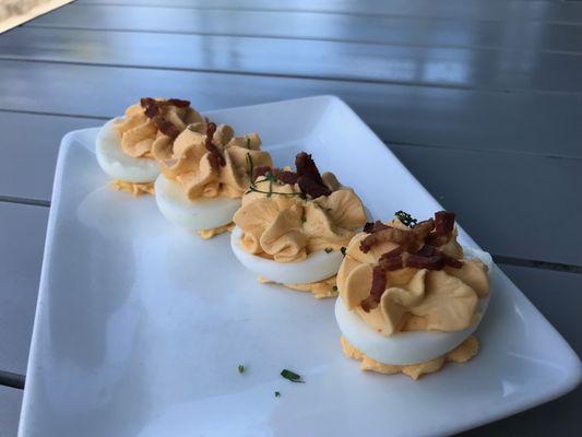 Sriracha (slightly spicy) deviled eggs with crispy bacon bits, for the egg lover!