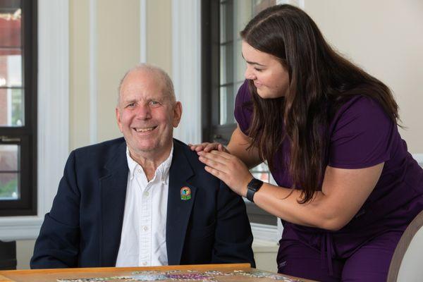 Oak Park Arms staff member with a resident.