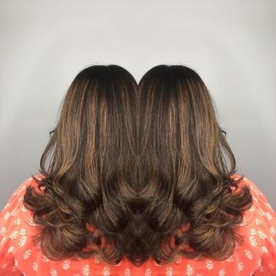 Brown base with a natural balayage and long layered haircut by Andrea