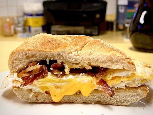 Bacon, egg, and cheese sandwich. Two eggs. Comes with one cup of coffee. $5.25 + tax + tip