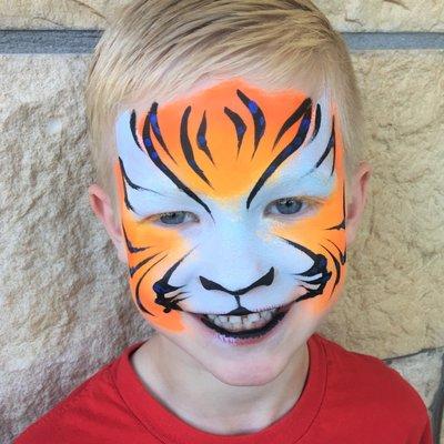 Full-face tiger face painting for boys and girls