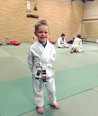 After getting his second stripe on his white belt.