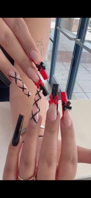 Long nails with deep french and bowtie design