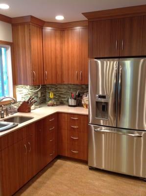 Bamboo cabinetry, reclaimed sea-shell counter tops and Marmoleum flooring makes for a beautiful, sustainable kitchen.