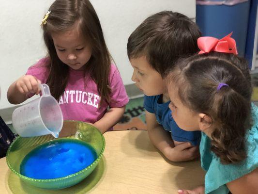 Science... we love to measure& pour, creating our very own silly puddy!