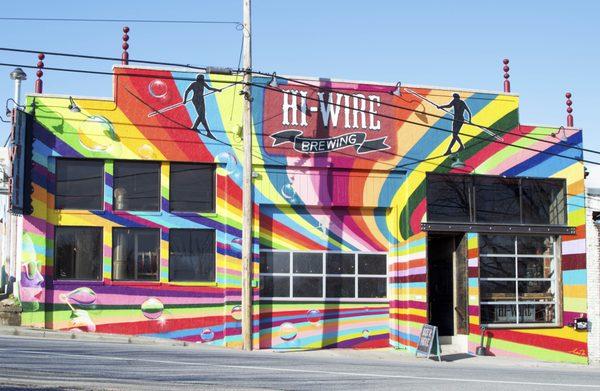 Hi-Wire Brewing's original brewery features a mural as bright as their approachable beers.