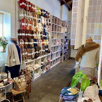 Interior of AVFKW as seen walking down the yarn section aisle. Spacious and bright, perfect for choosing your next project.