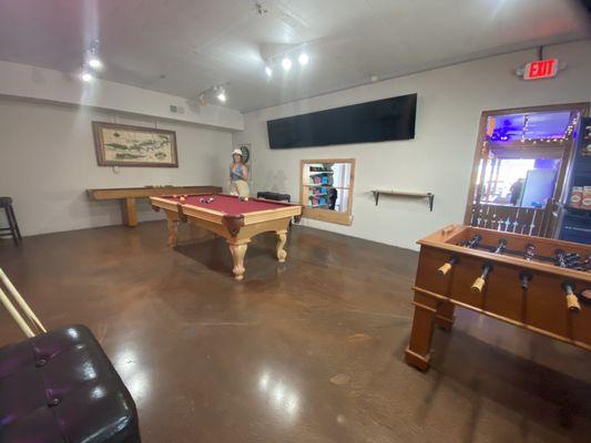 Game room in the back! Shuffleboard, foosball, pool, and a bar behind me