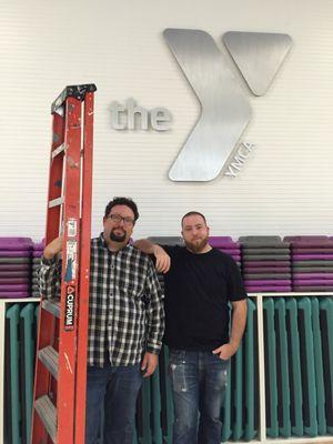 Eric & Nick installed the aluminum logo at the Y