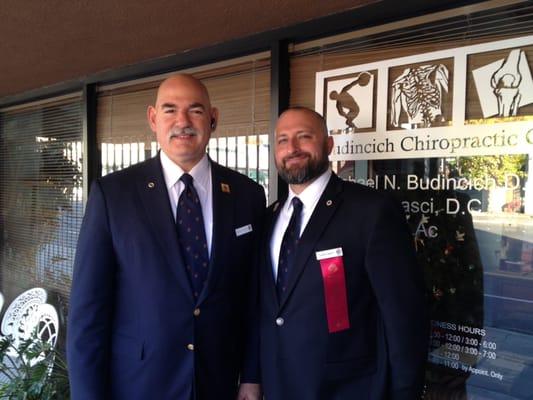 Dr. Budincich and Dr. Casci in their Pasadena Tournament of Roses volunteer attire before 2014 Rose Parade day.