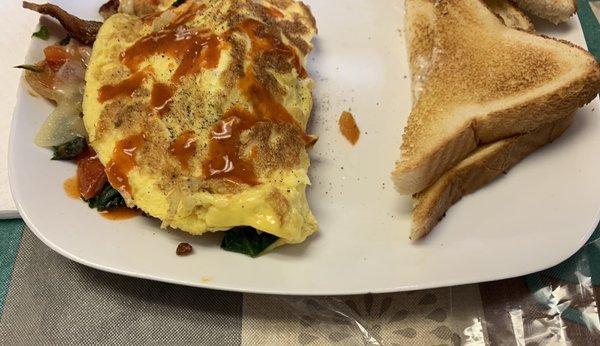 Fresh Veggie and bacon omelet.