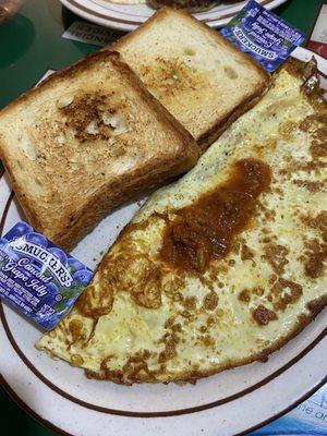 Greek omelet with Texas toast.  Just the right amount of Greek sauce, with a bit of a kick.