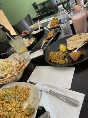 Chicken and lamb biryani, chicken samosa, naan and tikka masala