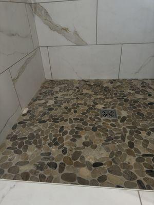 This shower floor's grout was yellow and stained before... not anymore!