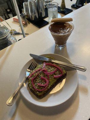 Tiramisu, latte and avocado toast with pickled onion.