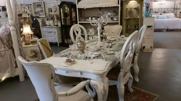 Nice table with a menagerie of interesting chairs.