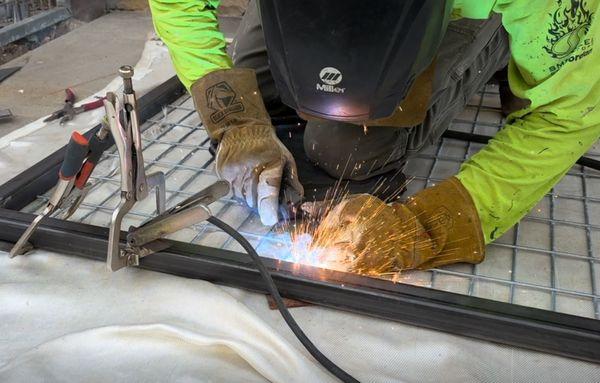 Welding agricultural style fencing to steel tubing