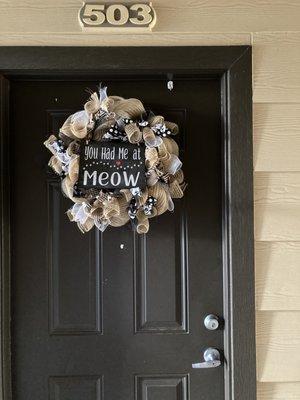 a brown door and my apt number above the door not beside it. It is brown not black--ask any 5 year old that kno ws thier colors.