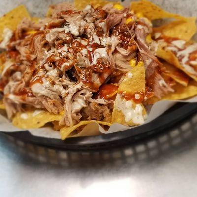 BBQ Nachos with in house BBQ Sauce and in house white sauce. This order had no Japs or Sour Cream but comes with if wanted.