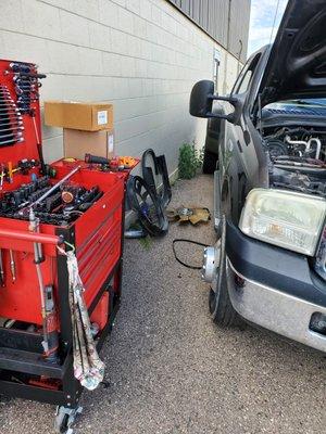 Working on this Ford F350 PowerStroke's AC compressor outside....the shop was already full.