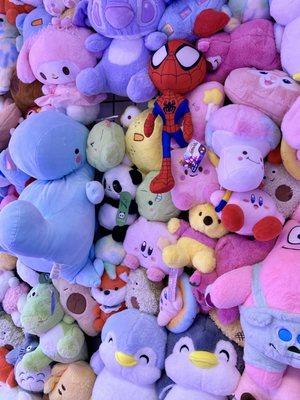 Take picture in front of a whole wall of plushies!