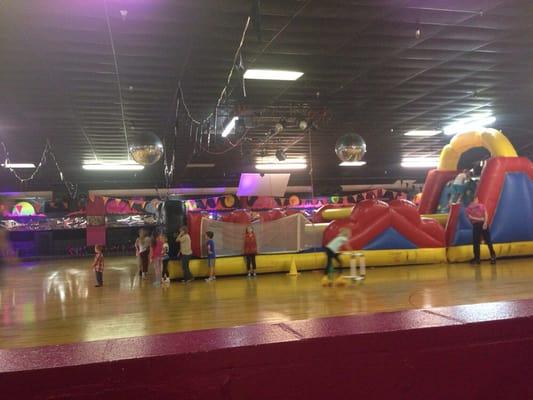 Skating area with inflatable play area in the middle section