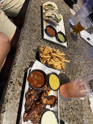 Steak tacos and Oven Roasted wings with sauce on the side