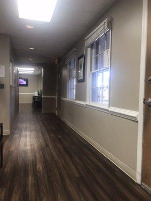 Hallway to next seating area with check in window 03-08-18