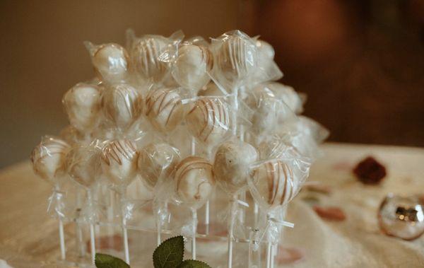 Cake pops by a piece of cake.