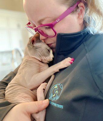 One of our staff cuddling with a patient