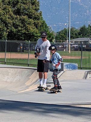 Coach Chris lends a hand as he gets comfortable cruising around the park.