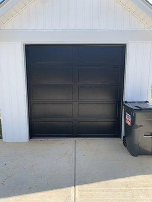 Contemporary long, recessed style door in black