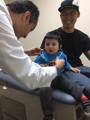 Dr. Arasheben letting my son use the stethoscope.