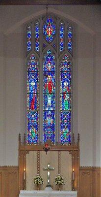 Above the altar is triptych window inspired by the "Te Deum," a hymn of praise which begins "We praise you O God."