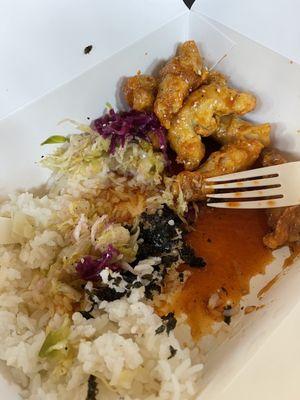 Chicken and rice with slaw and seaweed. Chicken tossed in house sauce.