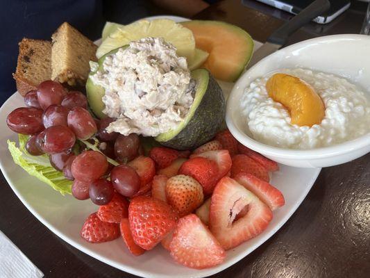 Avocado platter with chicken salad and fruits