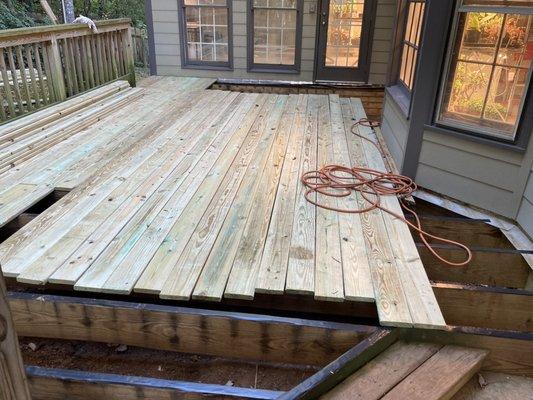 Replacing deck floor and adding waterproof tape to the joist so it will extend the life of them.