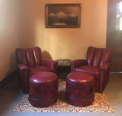 Custom floorcloth made to create the boundaries of this sitting area in a larger multi-use space.