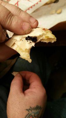 What is this nasty black piece in the quesadilla?