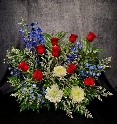 Sympathy fresh floral delivered to the service of a veteran.