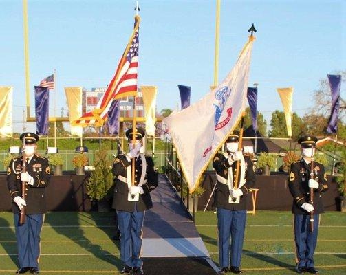 SSG Johnson, SSG Leung, SSG Kelly, and SFC Helfer presenting the National Colors at Warren High School's graduation ceremony.