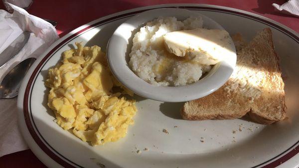 Two egg breakfast, grits and toast.