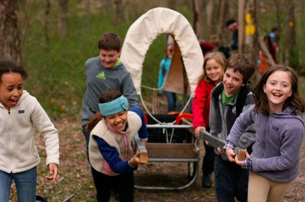 Students get a first-hand look at pioneer life during a week-long trip outside the city in the 9s (4th grade).