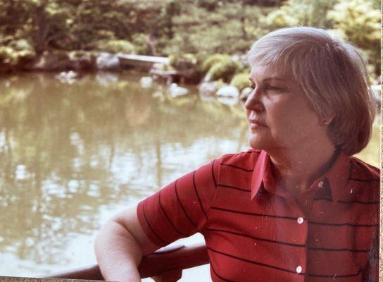 My mom resting in a Japanese Garden , & Pond. 1982. NYC.