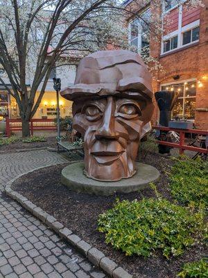 The "Big Head" in the courtyard at Village Gate.