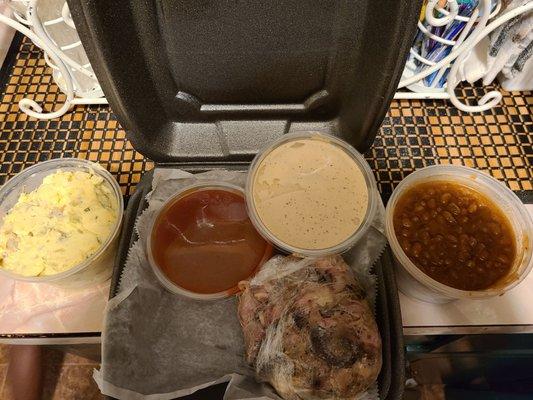 Family meal: Pork, 2 sides (potato salad and baked beans), red and white BBQ sauce(requested)