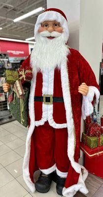 This Santa greets you, as you walk in the roped off entry way, with the security guard.